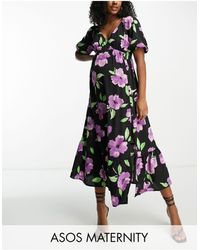 ASOS - Asos design maternity - vestito midi con corpino a portafoglio e fondo peplo a fiori grandi viola con bottoni sulla gonna - Lyst