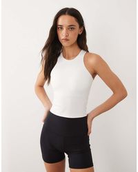 4505 - Icon Active Racerback Singlet With Inner Bra And Removable Padding - Lyst
