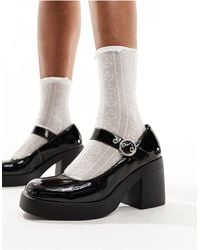 Truffle Collection - Zapatos negros estilo merceditas con tacón - Lyst