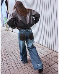 Bershka - High-waist Barrel Jeans With Leather Effect Pocket - Lyst
