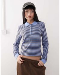 Monki - – langärmliges polohemd aus pikee mit streifen - Lyst