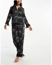 Chelsea Peers - Pyjama avec top boutonné à côtes métallisées et pantalon à imprimé zèbres - Lyst