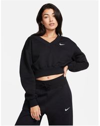 Nike - Felpa taglio corto nera con logo piccolo e scollo a v - Lyst