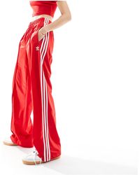adidas Originals - Firebird - pantaloni sportivi rossi - Lyst