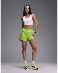 4505 - Premium Woven High Waist 3 Inch Running Short With Jersey Liner And Phone Pocket - Lyst