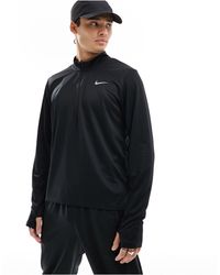 Nike - Dri-fit pacer - top con zip corta - Lyst