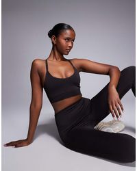 4505 - Seamless Multi Strap Medium Support Sports Bra With Removable Padding - Lyst