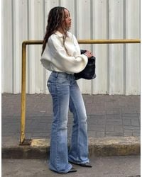 Bershka - Embroidered Low-rise Flared Jeans - Lyst