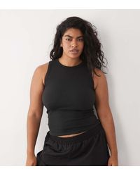 4505 - Curve Seamless Lightweight Rib 90s Racer Vest - Lyst