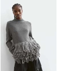 ARRANGE - Knitted Sweater With Fringe Hem - Lyst