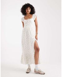 Hollister - Vestido Midi De Estilo Mesonera Con Estampado Floral, Escote Bardot Y Abertura De - Lyst