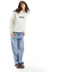 Levi's - Sudadera color con capucha y logo en el pecho exclusiva en asos - Lyst