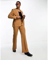 ASOS - Pantaloni da abito a zampa color tabacco con tasche sul davanti - Lyst