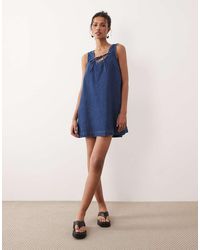 ASOS - Denim Scoop Mini Dress With Bow Front - Lyst
