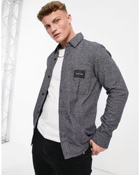 Camisas Calvin Klein de hombre: hasta el 50 % de descuento | Lyst