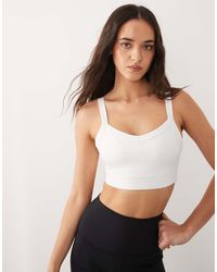4505 - Icon Active Medium Support Sports Bra With Removable Padding And Adjustable Straps - Lyst