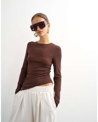 TOPSHOP - Premium Rib Ruched Asymmetric Hem Long Sleeve Top - Lyst