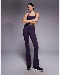 4505 - Icon High Waist Slim Kick Yoga legging - Lyst
