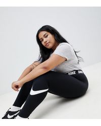 Nike Legasee - Leggings neri con logo in vita - Nero