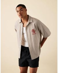 ASOS - Chemise oversize coupe carrée à carreaux et broderie sur le devant - marron - Lyst
