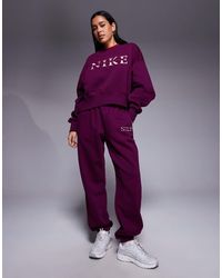 nike mini metallic swoosh oversized tracksuit in purple