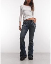 The Ragged Priest - Low Rise Flare Jean With Eyelet Detailing - Lyst