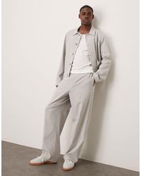 ASOS - Pantalon d'ensemble large élégant en crépon avec taille élastique - clair - Lyst