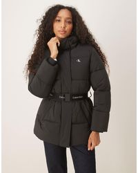 Calvin Klein - – mittellange pufferjacke - Lyst