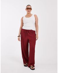 ONLY - High-waist-hose mit weitem bein und crinkle-struktur - Lyst