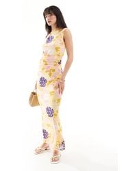 Vero Moda - Robe longue sans manches en tulle à col montant et imprimé fleurs - citron - Lyst