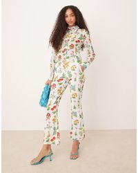 Tyler McGillivary - Uma Flower Print Flared Trousers - Lyst