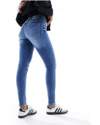 Pimkie - Jeans skinny a vita alta lavaggio blu - Lyst