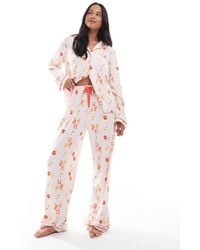 Loungeable - Pyjamaset Van Superzachte Jersey Van Top Met Reverskraag En Broek Met Wijde Pijpen, Biezen En Cowboy-Cactusprint - Lyst