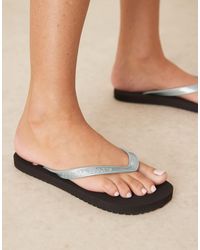 Calvin Klein - – zehenstegsandalen - Lyst