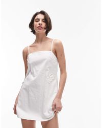 SNDY'S - Robe courte en lin mélangé à bretelles fines avec encolure carrée et appliqués fleuris - Lyst