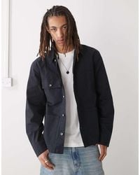 Champion - Chaqueta Negra De Tejido Liso De - Lyst