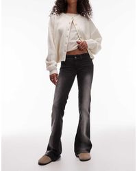 Cheap Monday - Vaqueros Negros Elásticos De Talle Bajo Y Corte Bootcut Booty Bei De - Lyst