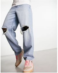 ASOS - Jeans ampi lavaggio chiaro con strappi sulle ginocchia - Lyst