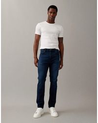 Wrangler - – larston – schmale karottenjeans - Lyst