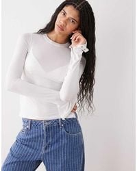 Weekday - Long Sleeve Fitted Top With Button Detailing And Asymmetric Hem - Lyst