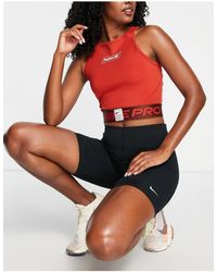 Nike - Nike pro training - grx - débardeur court à logo - foncé - Lyst