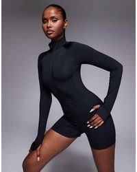 4505 - Active Quick Dry Running Zip Up Romper With Zip Phone Pocket And Back Vent - Lyst