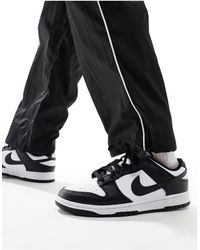Nike - Dunk low retro - sneakers nere e bianche - Lyst