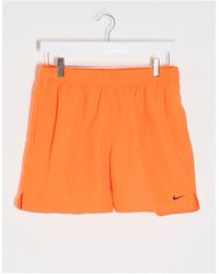 nike swimming 5inch volley shorts with all over swoosh print in black