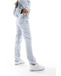 Calvin Klein - Jeans dritti a vita bassa lavaggio chiaro - Lyst