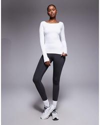 4505 - Active Boat Neck Long Sleeve Top With Thumbhole - Lyst