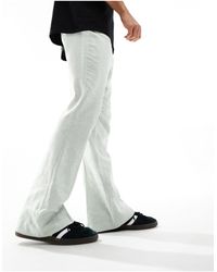 ASOS - Pantaloni eleganti a zampa e a vita alta salvia con motivo a spina di pesce - Lyst