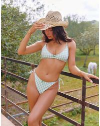 The Frolic - X lydia kara – exklusive bikinihose mit schleifendetail und salbeiem vichy-karo, kombiteil - Lyst