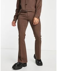 ASOS - Pantaloni eleganti a zampa marroni con motivo geometrico a quadri - Lyst