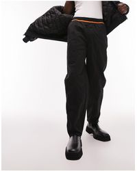 TOPMAN - Pantalon ample en nylon à taille élastiquée avec liseré orange - Lyst